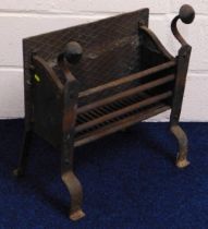 A free standing iron fire grate, 24in high x 22.5i