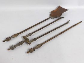 A brass plated copper companion set, longest piece