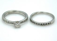 A platinum engagement & half eternity ring set wit