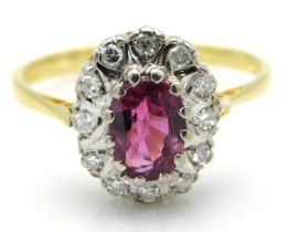 An 18ct gold ruby & diamond ring, ring head 12mm x