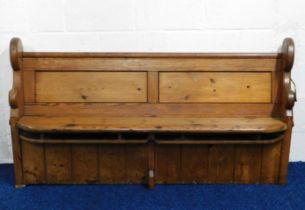 An antique pitch pine church pew, 70in wide x 35.2