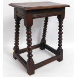 An early 20thC. oak stool, 22.75in high