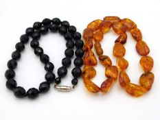 An amber necklace, 22.8g twinned with a faceted je