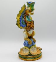 A 19thC. faience winged lion candle holder, 11.75i