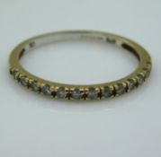 A 9ct gold ring set with CZ stones, 0.9g, size N/O