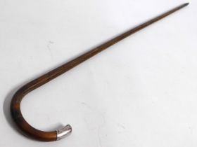 An antique gents walking cane with 1919 J. Howell