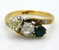 An 18ct gold ring set with four small diamonds on