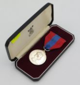 A cased Royal Mint twenty five year service medal