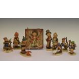 Seven Goebel Hummel figures and a wall plaque