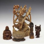 Carved Indian figure together with a selection of wood carvings
