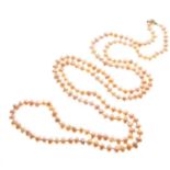 Row of pink-coloured freshwater pearls