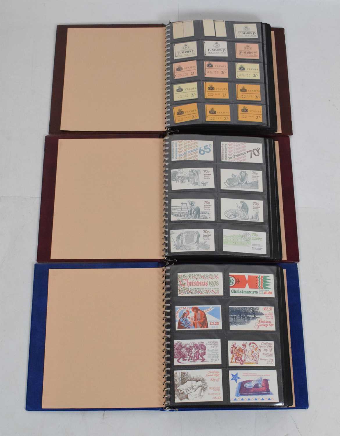 Collection of Royal Mail postage stamp books in three albums