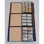 Collection of Royal Mail postage stamp books in three albums
