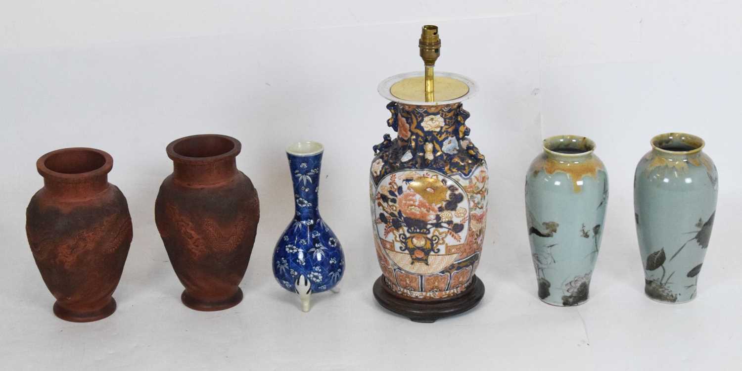 Pair of Chinese pottery vases with dragon decoration,