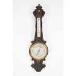 Edwardian carved oak aneroid barometer