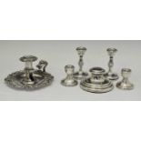 Elizabeth II silver capstan inkwell, two pairs of dwarf candlesticks, etc