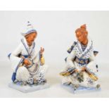 Pair of polychrome painted and gilded ceramic figures