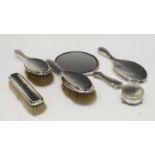 Three George VI silver dressing table brushes plus two mirrors and a trinket pot