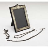 Elizabeth II silver easel picture frame, two silver Alberts and a white metal chain