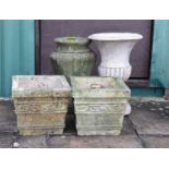 Pair of composite stone square garden planters, together with an urn and plastic urn