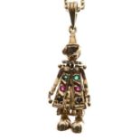Yellow metal articulated Pierrot pendant with 9ct gold chain