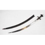 An Indian sword 'Tulwar', with a single edged curved 30" blade