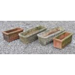 Pair of composite stone troughs, and a pair of terracotta rectangular planters