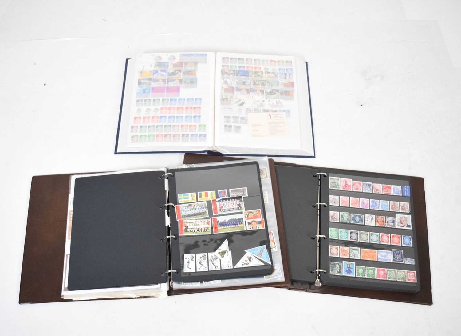 Stock album of GB stamps together with two albums of world stamps