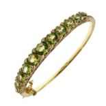 Edwardian style 14ct gold peridot and diamond hinged bangle