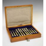 Cased set of twelve fruit knives and forks with horn inlaid handles