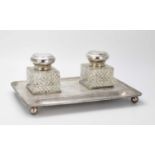 George V silver presentation desk stand with two cut glass inkwells