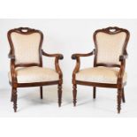 Pair of mahogany open armchairs