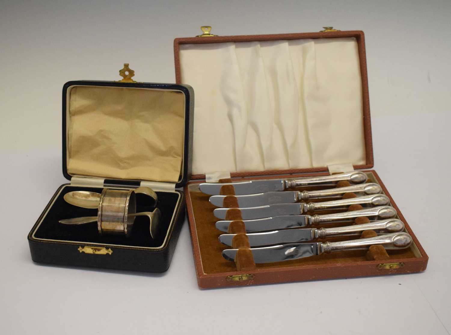 Cased three-piece silver christening set, and a cased set of silver handled butter knives