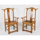 Pair of Chinese elm arm chairs having cane seats