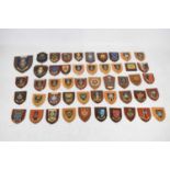 Quantity of military and civilian wooden mounted crests