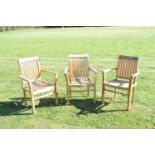 Three teak garden chairs