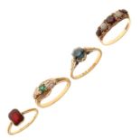 Four 9ct gold stone set dress rings