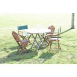 Teak patio table and a matched set of four garden chairs