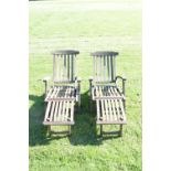 Pair of teak reclining steamer chairs