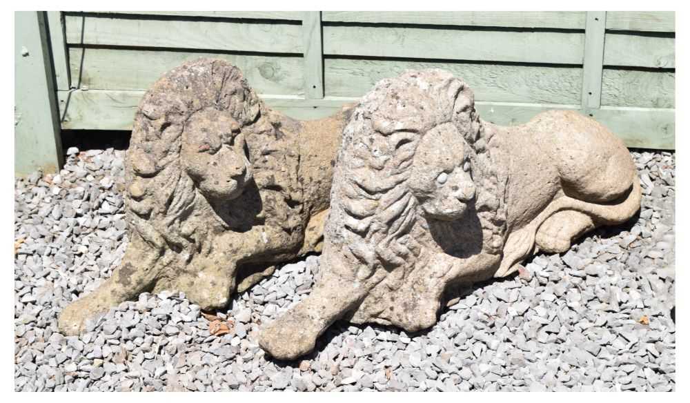 Pair of composite stone garden lions in recumbent posture - Image 5 of 11