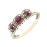 Unmarked white metal ruby three-stone dress ring