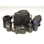 Olympus E-500 camera and three camera lenses