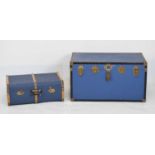Two blue luggage trunks