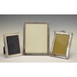 Three silver photo frames