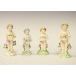 Four porcelain putti