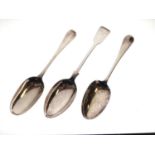Two George II silver Hanoverian spoons and a George V fiddle pattern tablespoon