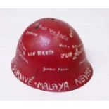 Malaya Campaign - red painted metal helmet