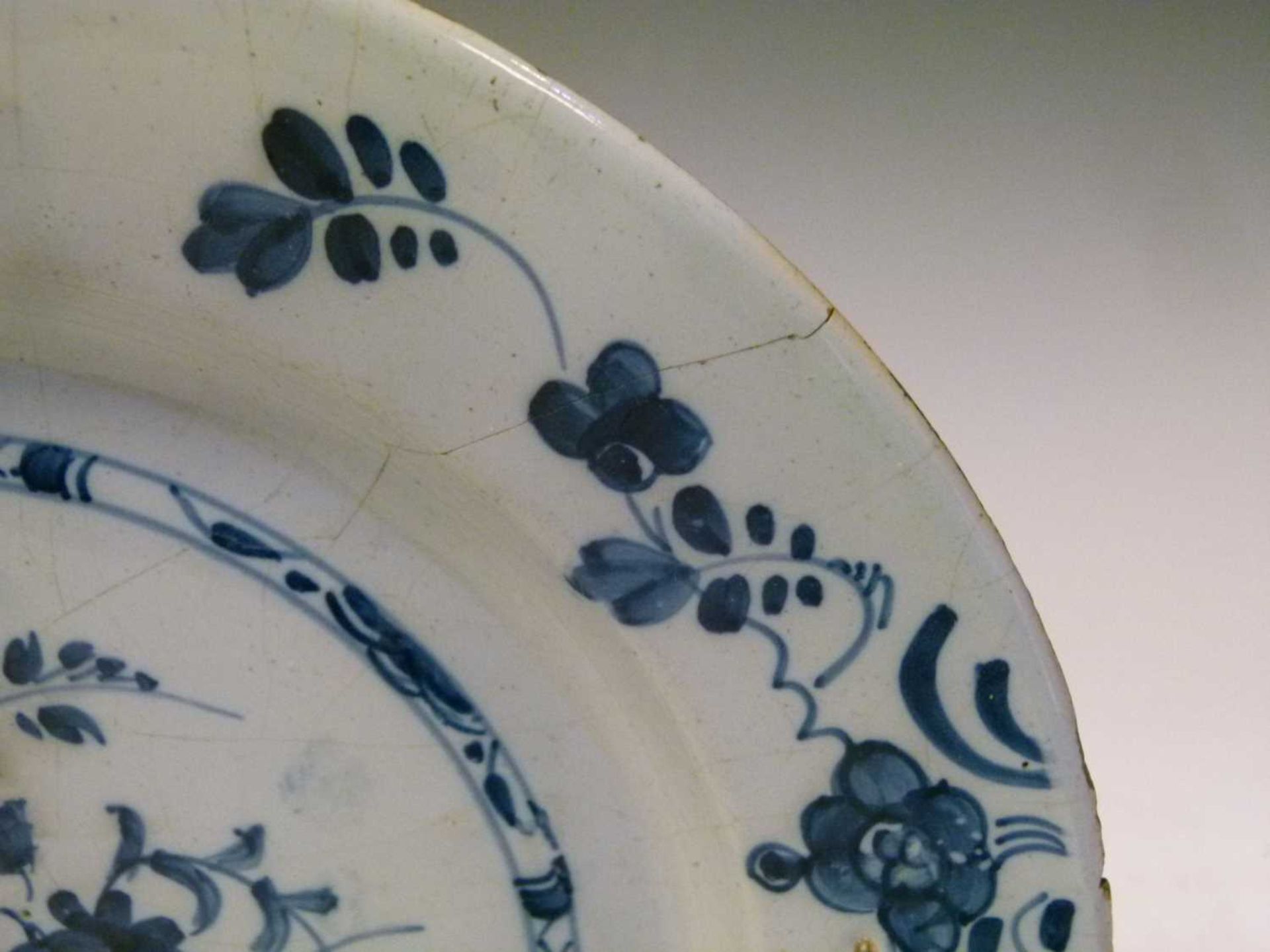 Four 18th Century English delft plates - Image 18 of 19