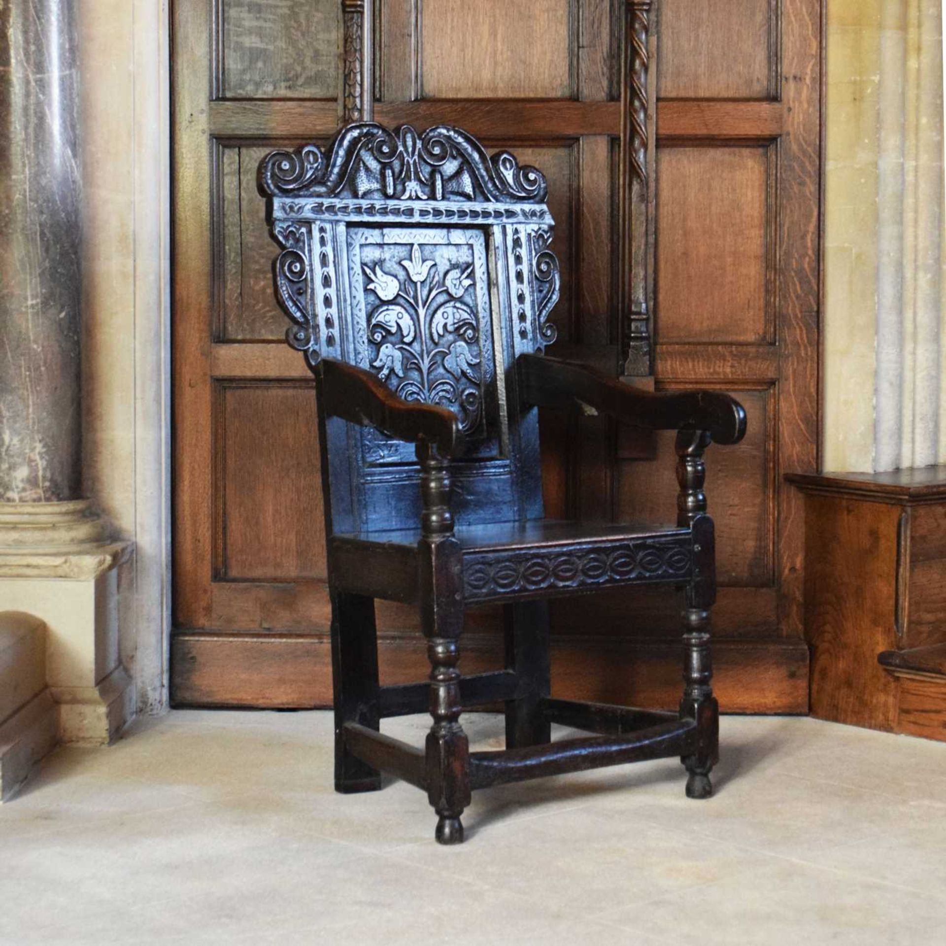Charles II oak panel-back open armchair