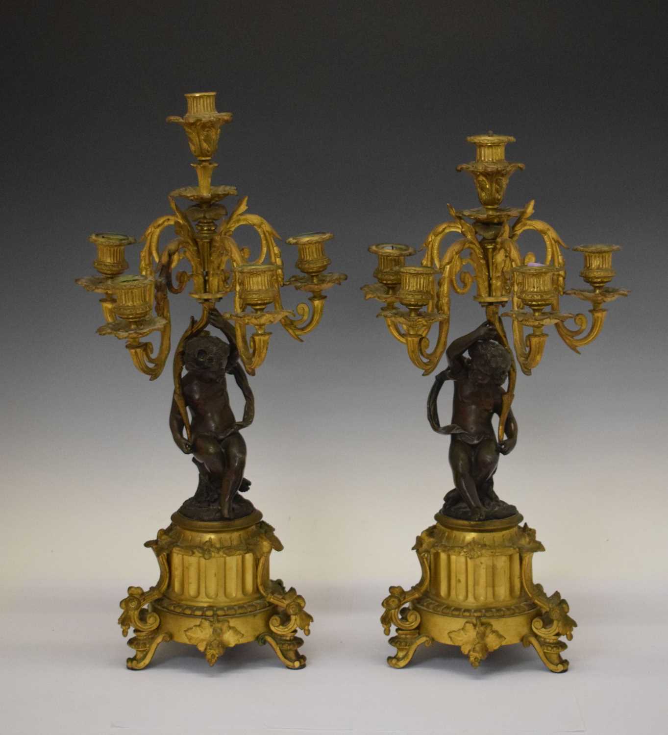 Pair mid 19th Century French patinated bronze and ormolu figural candlesticks